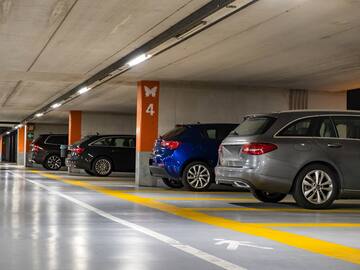 a parking garage with cars parked in it