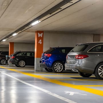 a parking garage with cars parked in it