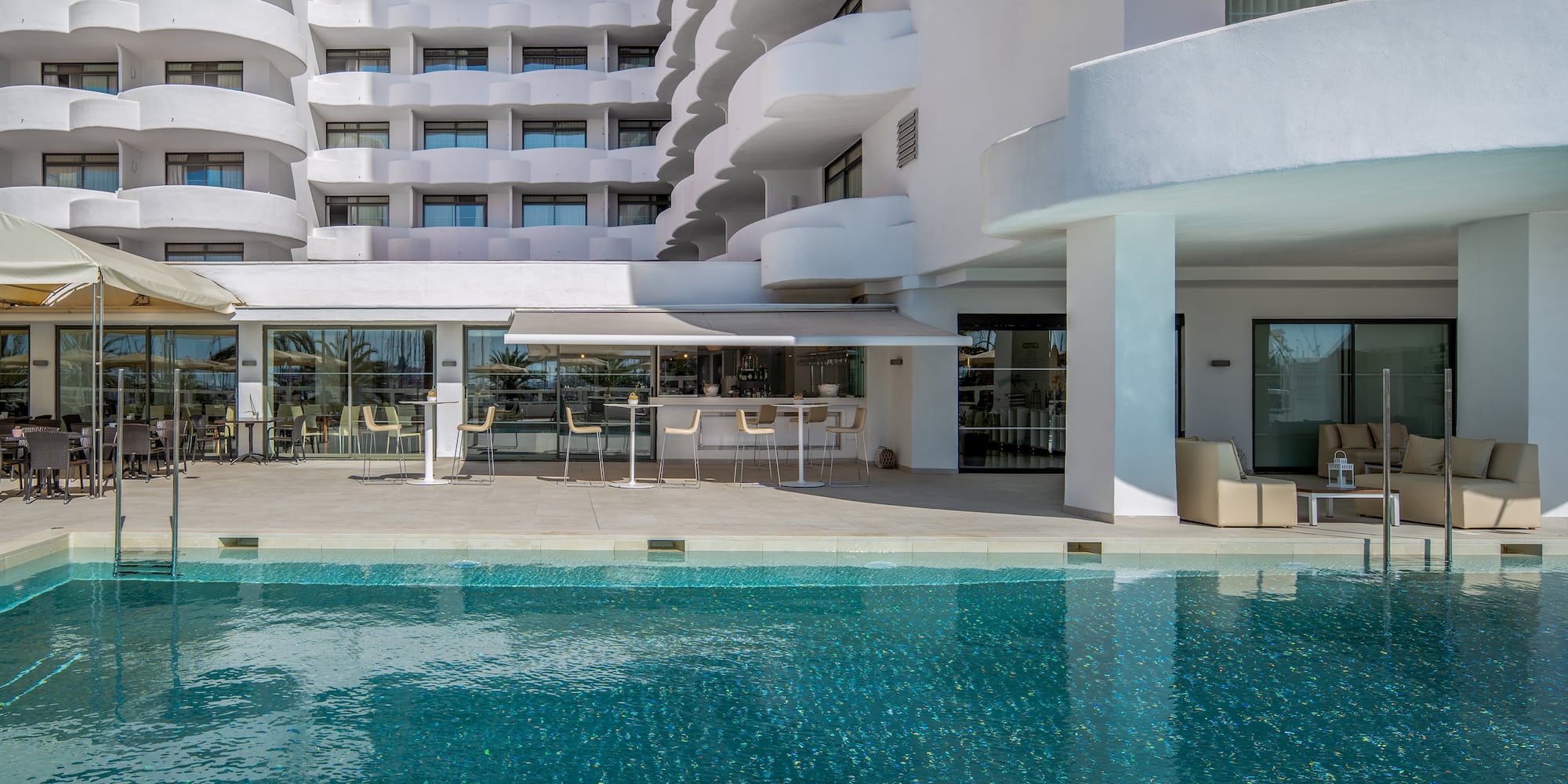 a swimming pool in front of a building