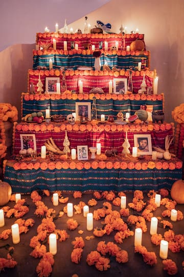 a staircase with flowers and candles