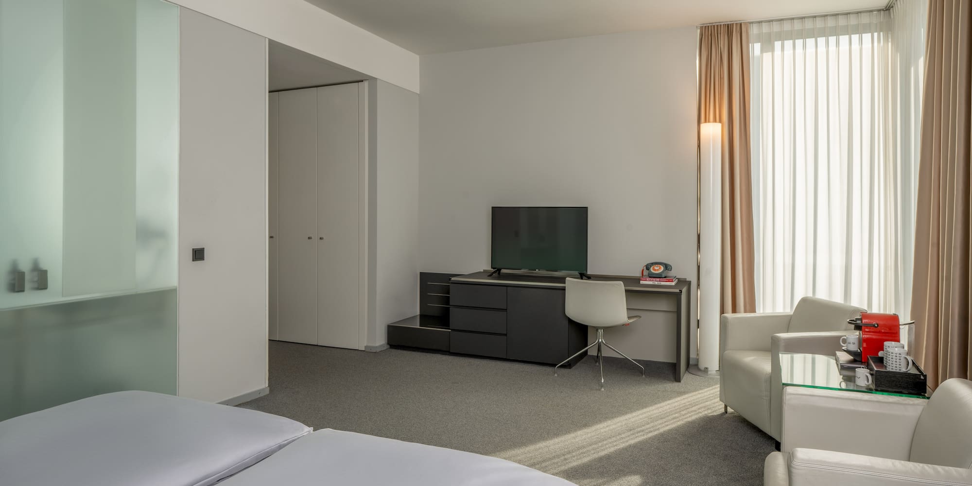 a room with a tv and a chair