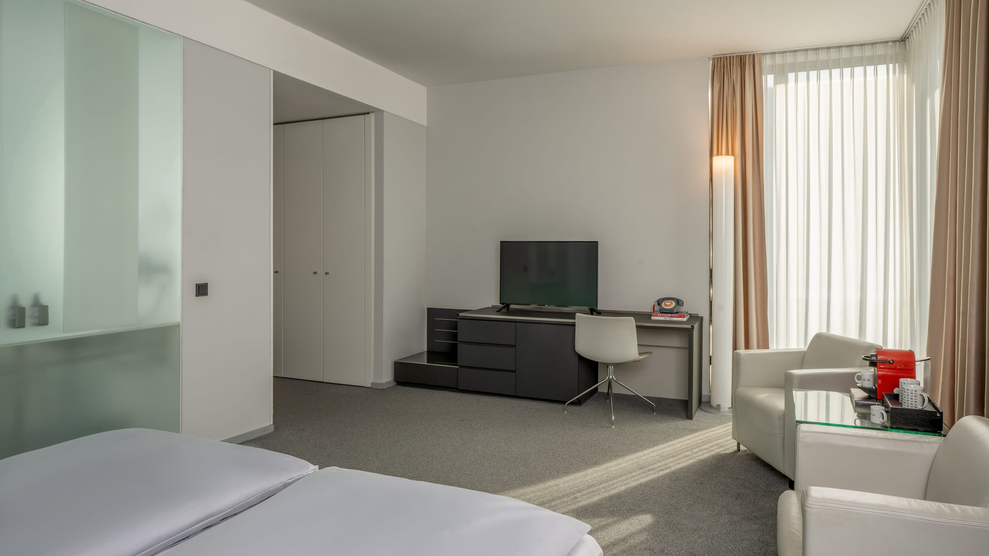 a room with a tv and a chair