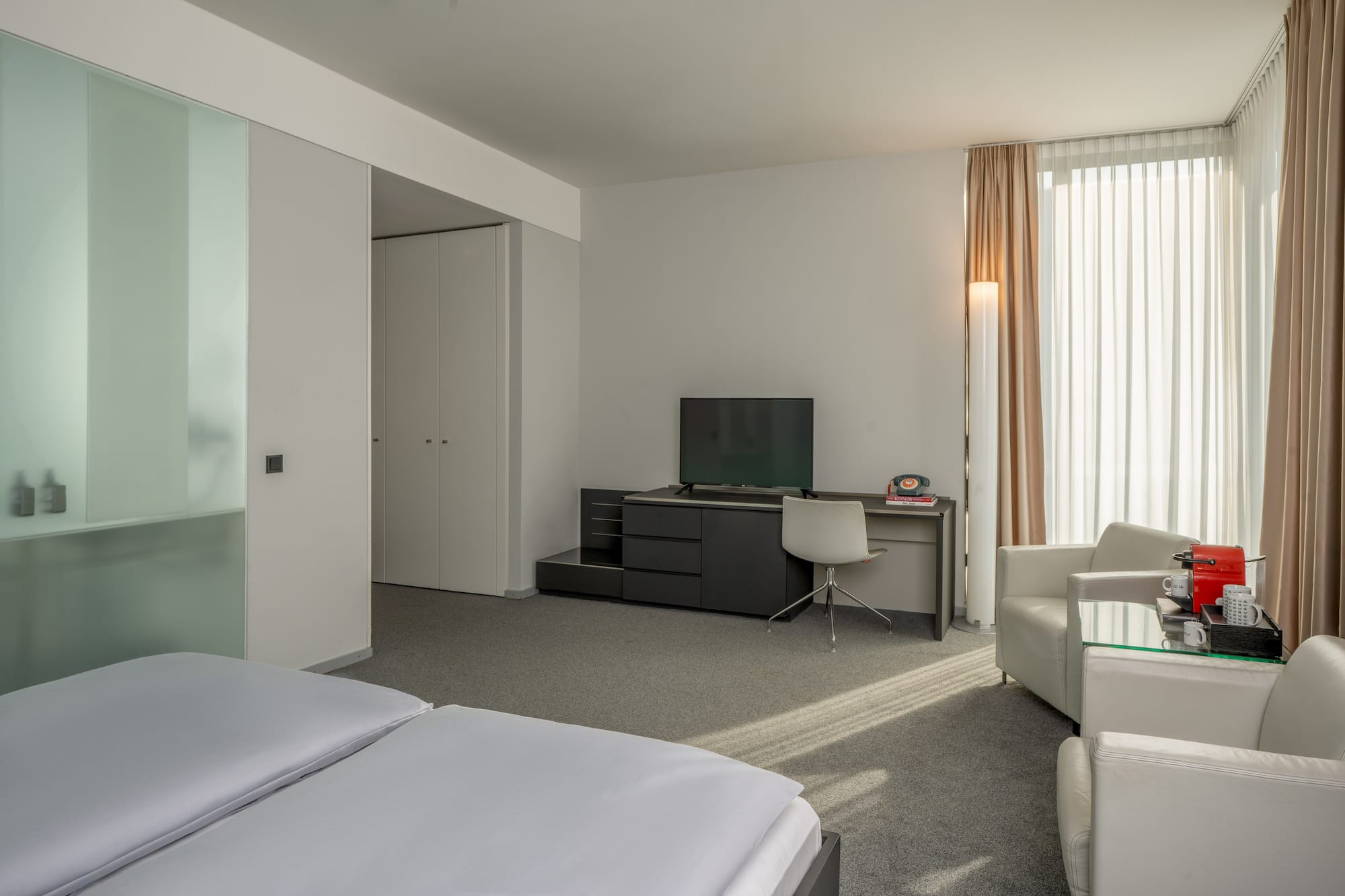 a room with a tv and a chair