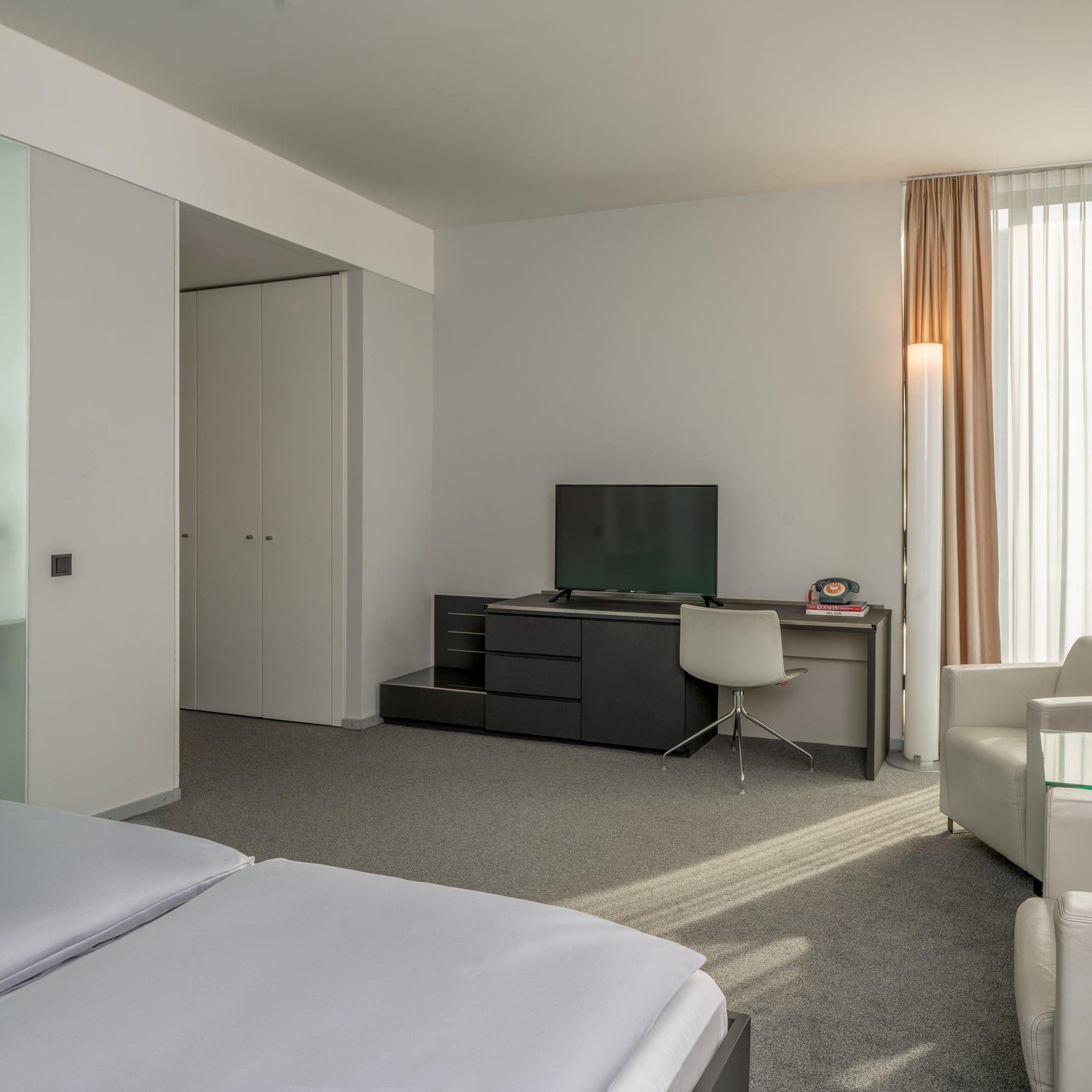 a room with a tv and a chair