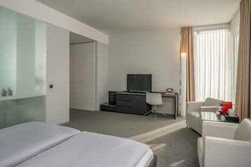 a room with a tv and a chair