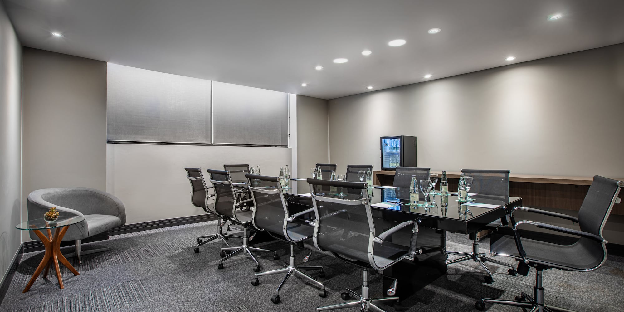 a conference room with a table and chairs