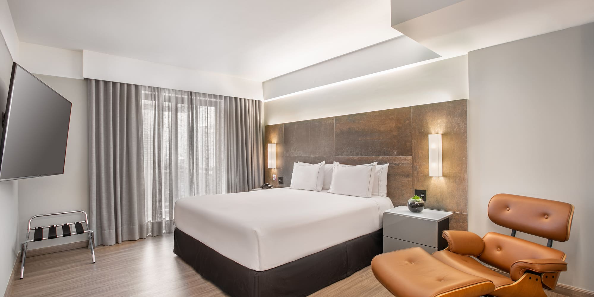 a room with a bed and a chair