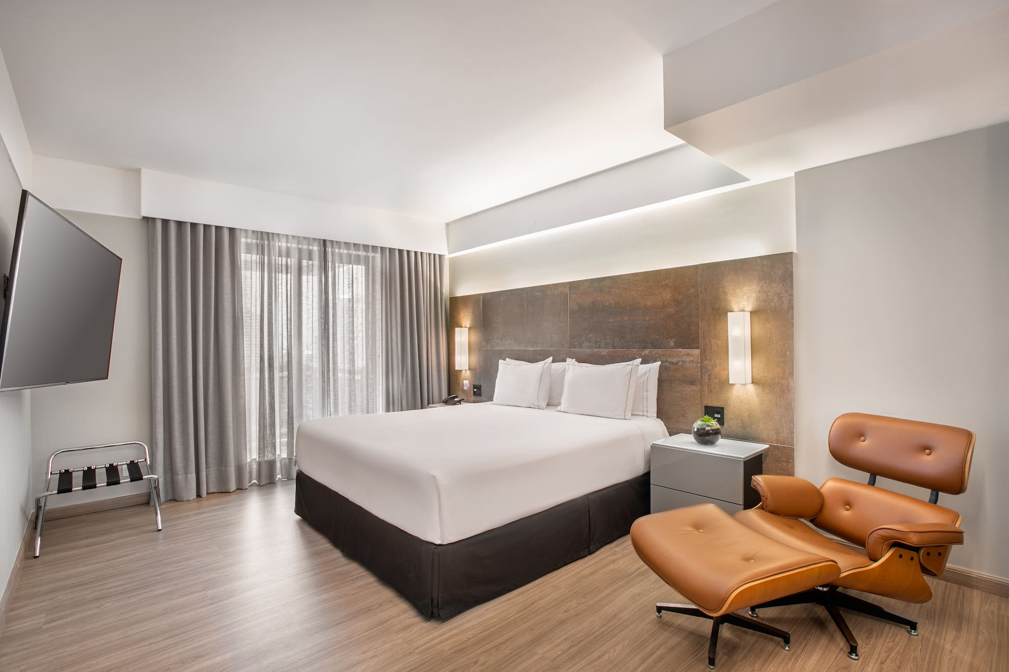 a room with a bed and a chair