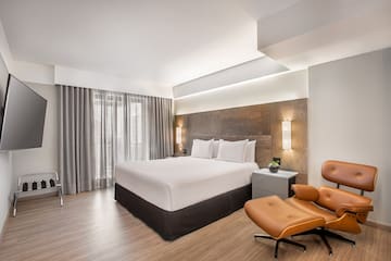 a room with a bed and a chair