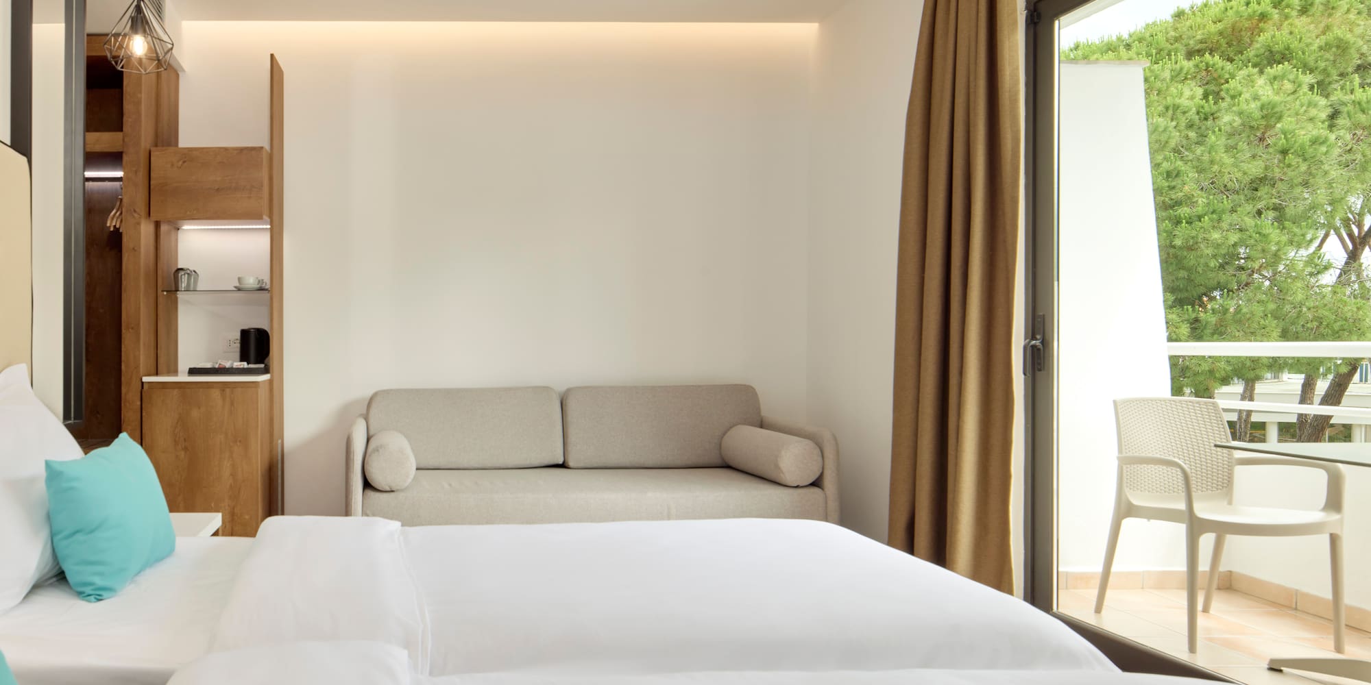 a room with two beds and a couch