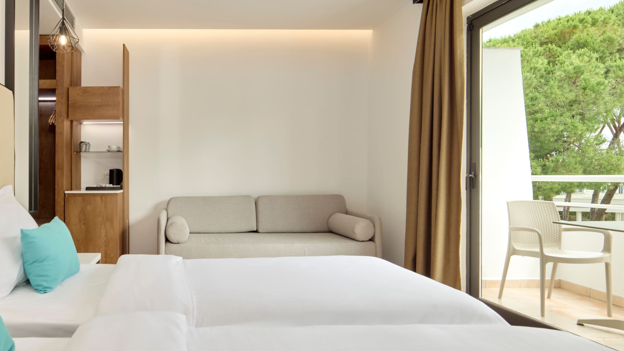 a room with two beds and a couch