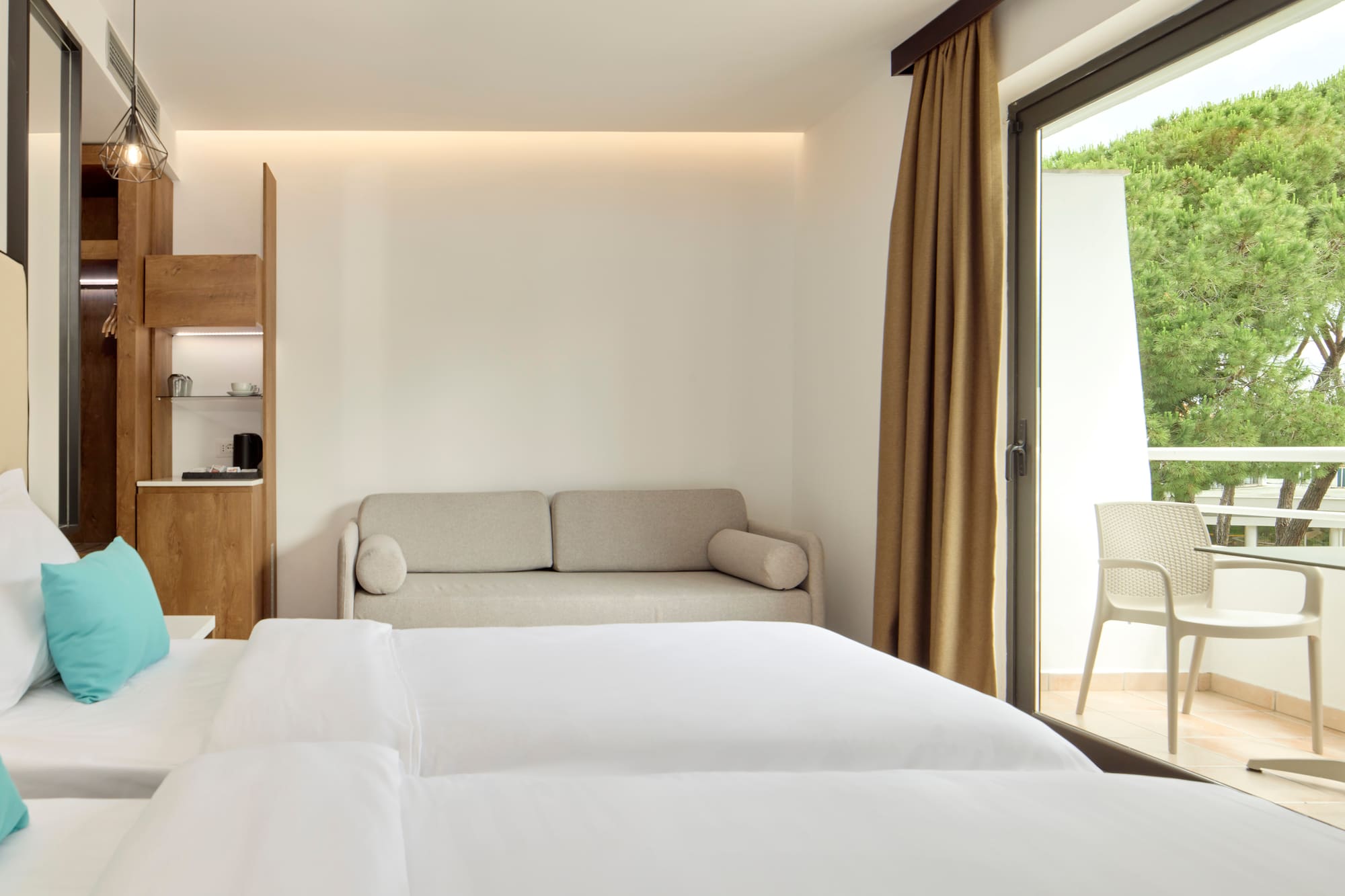 a room with two beds and a couch