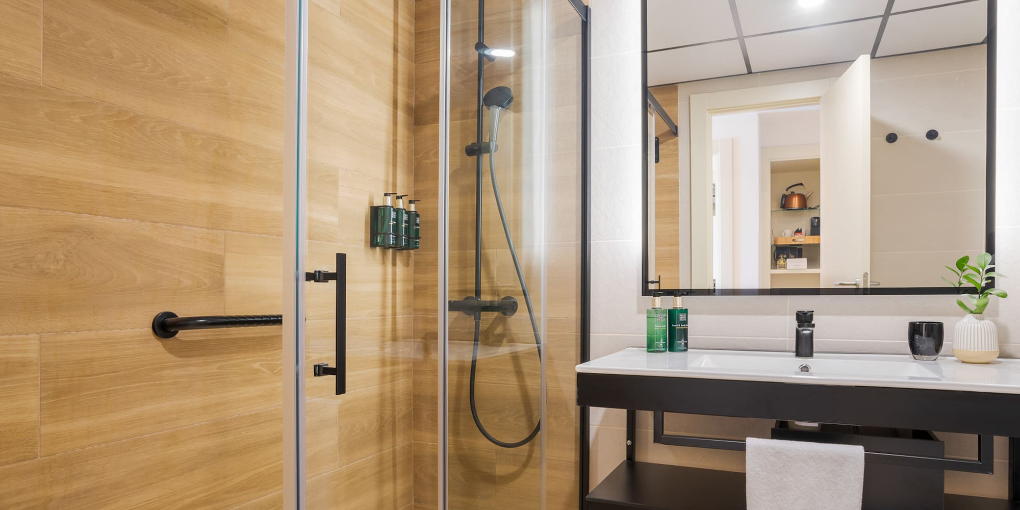 a bathroom with a shower and sink