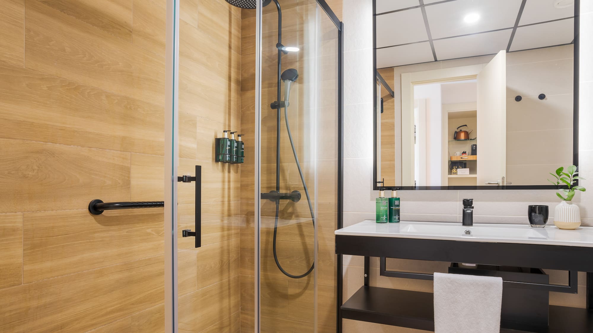 a bathroom with a shower and sink