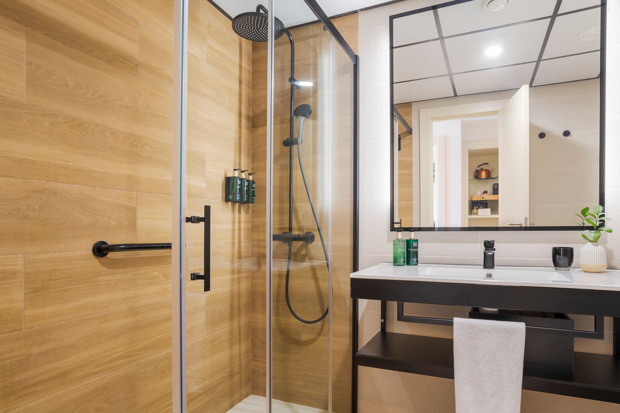 a bathroom with a shower and sink