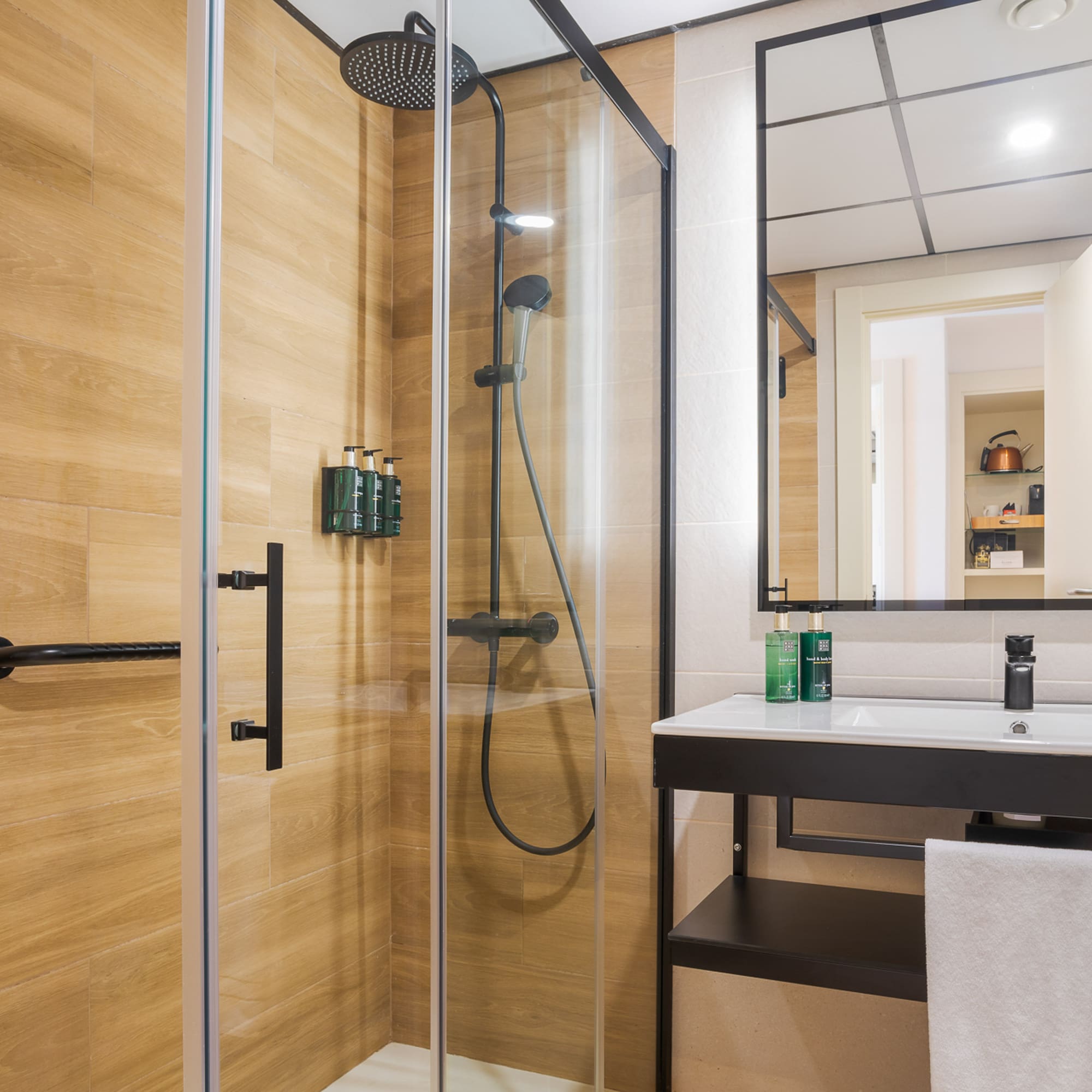 a bathroom with a shower and sink