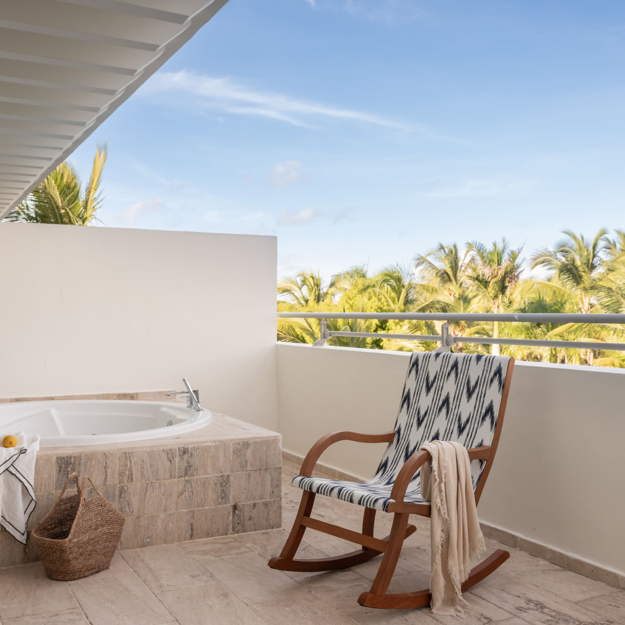 a chair next to a jacuzzi