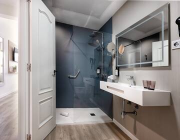 a bathroom with a shower and sink