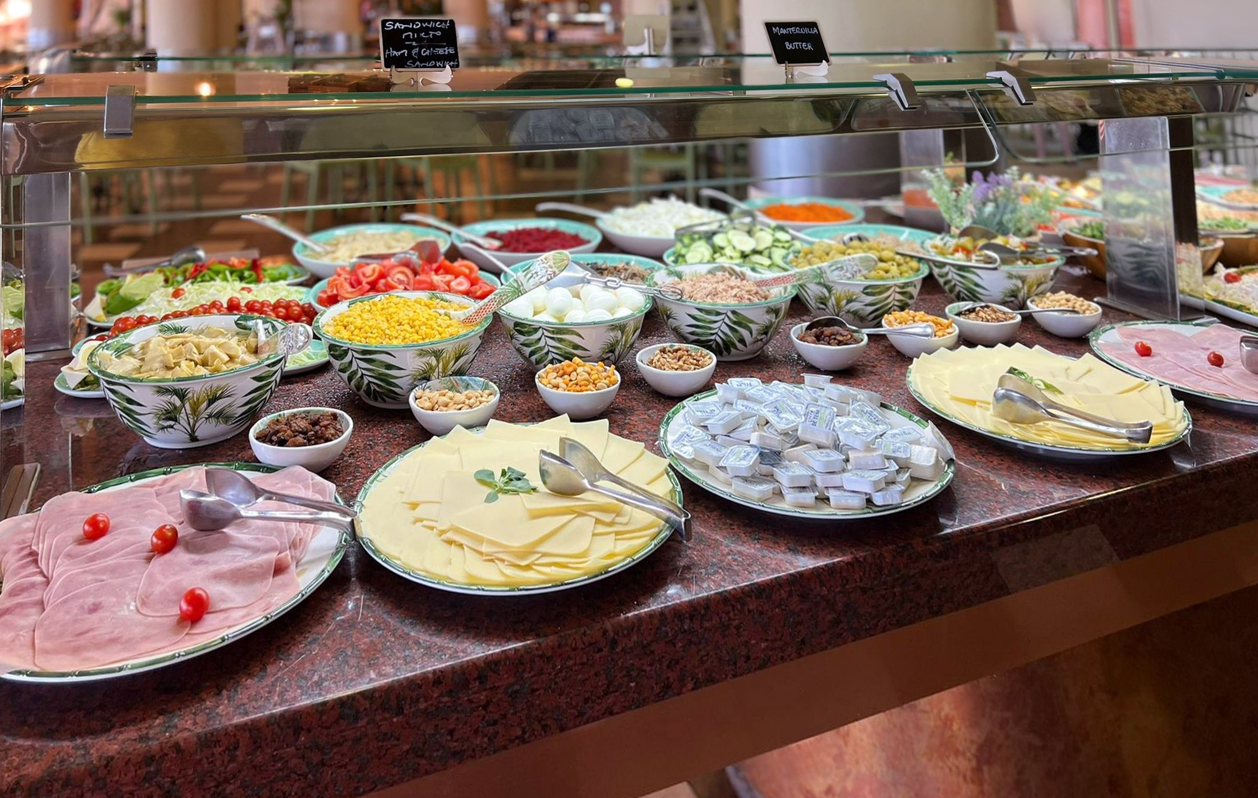 a display case with different foods on it