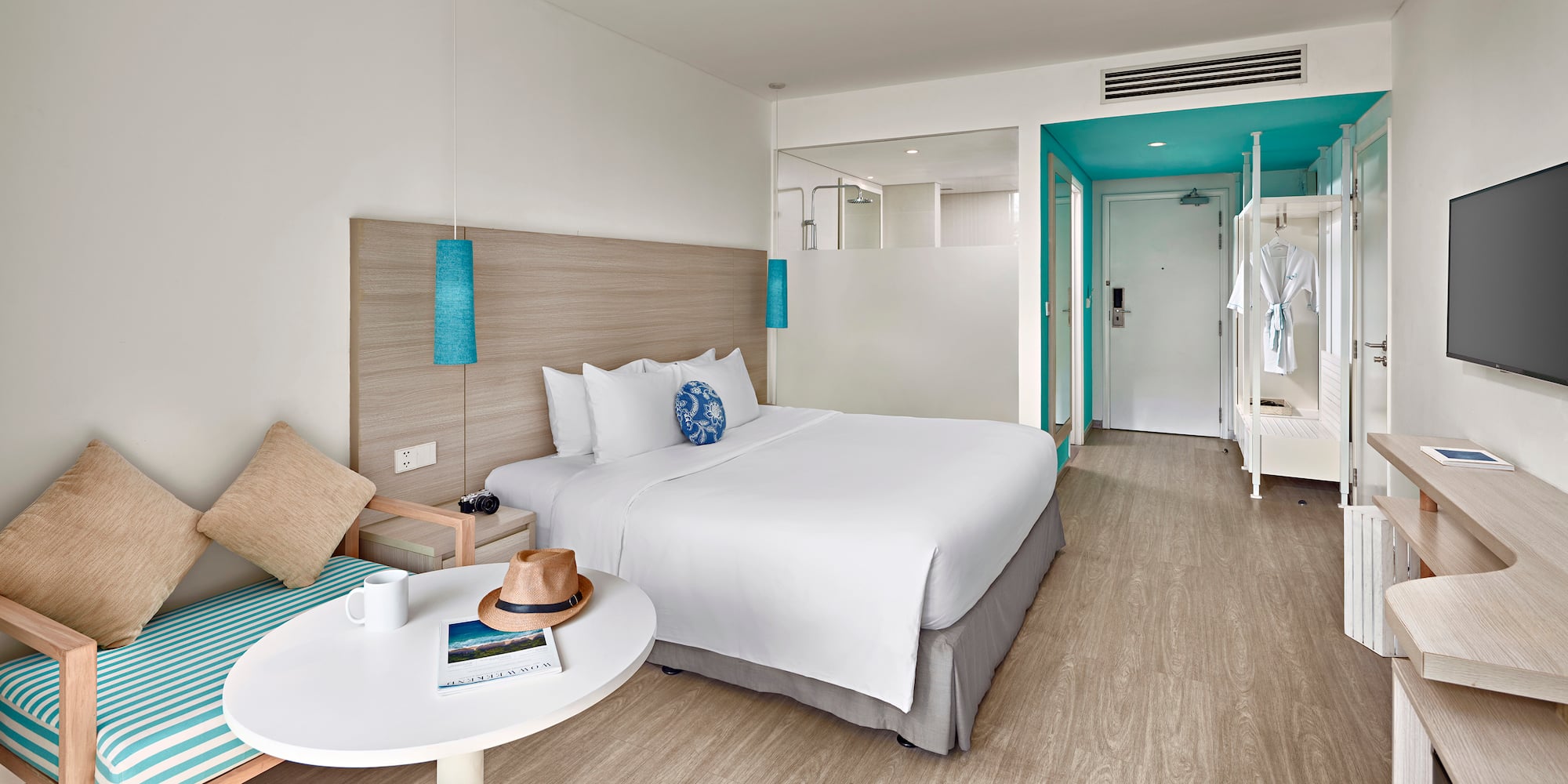 a hotel room with a bed and a table