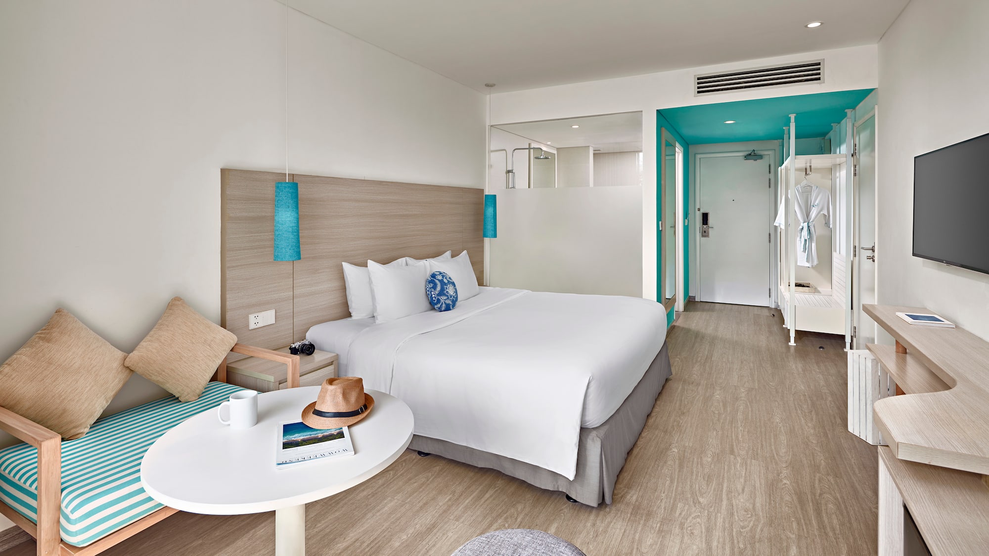 a hotel room with a bed and a table