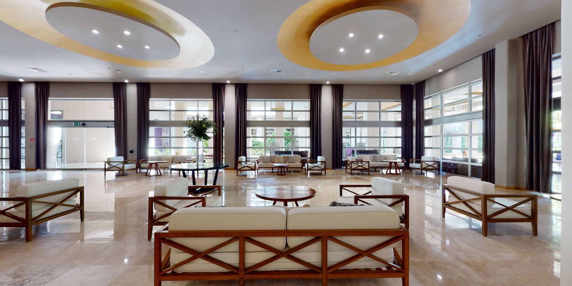 a large room with a large couch and tables