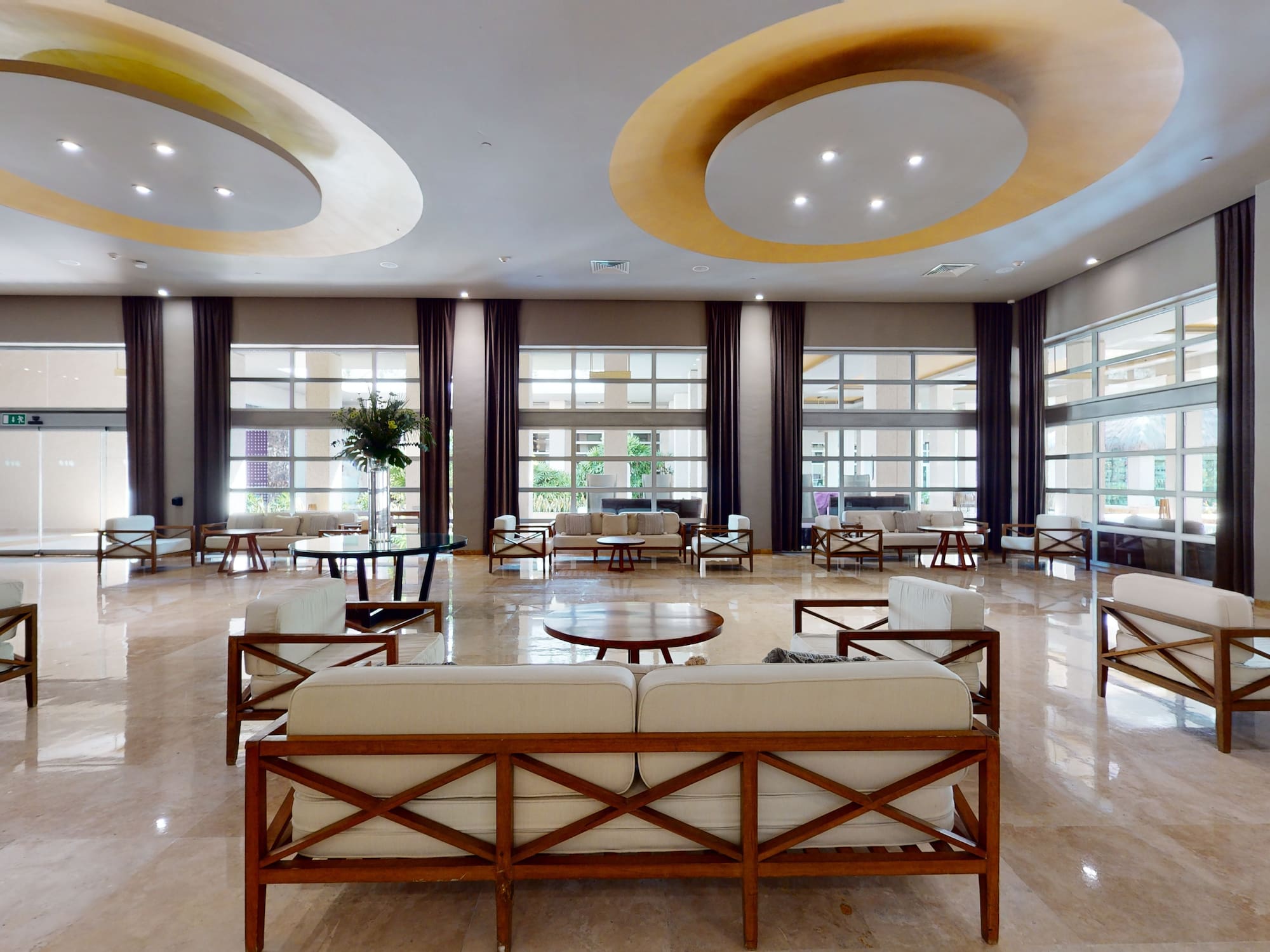 a large room with a large couch and tables