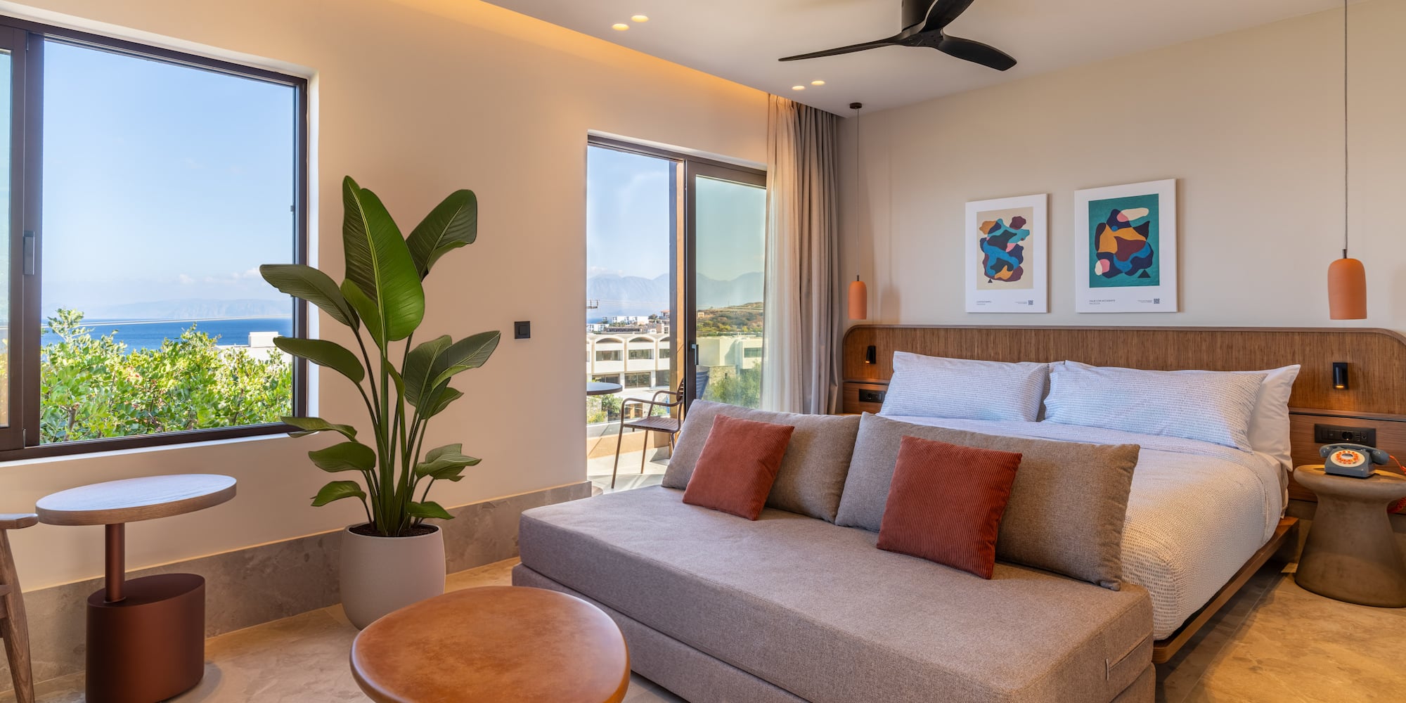 a bedroom with a bed and a plant