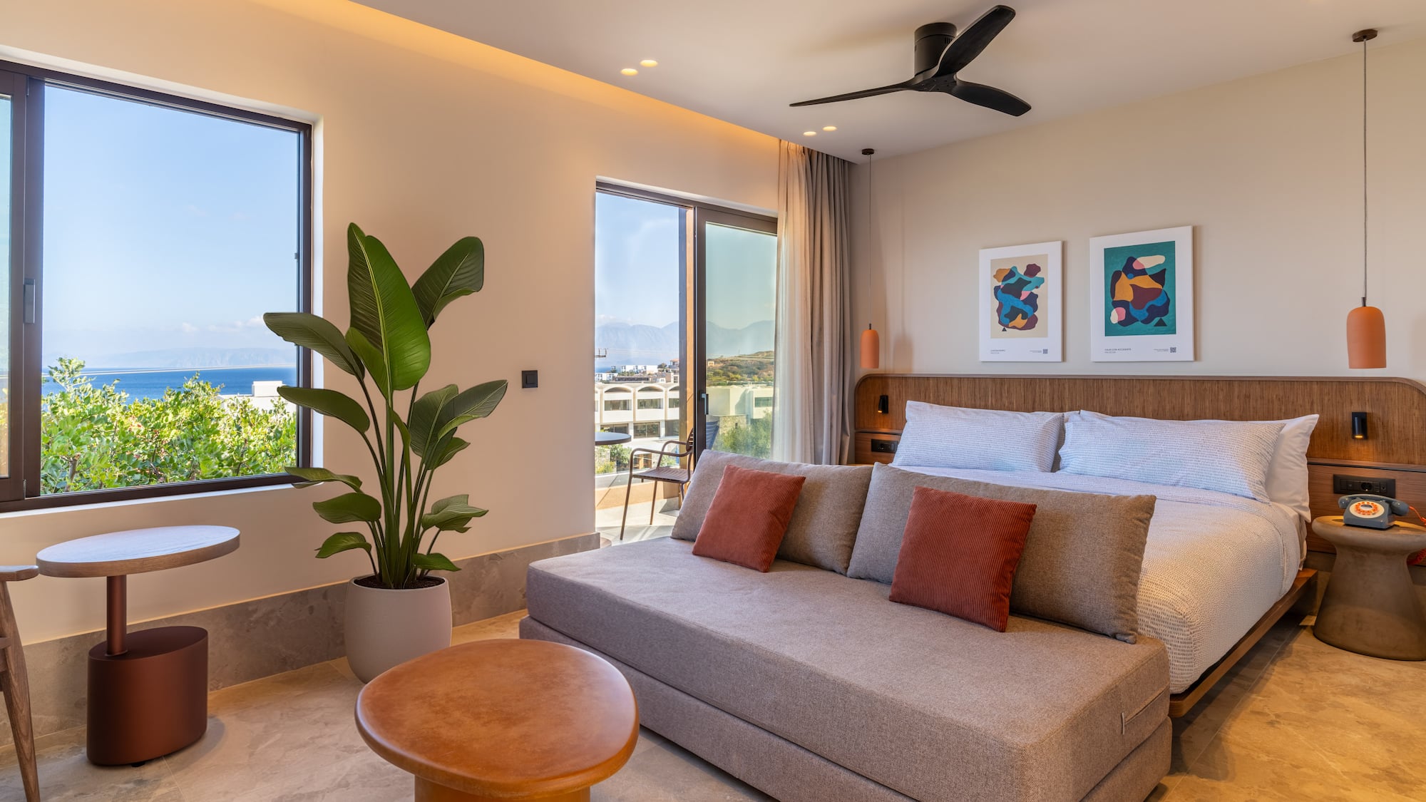 a bedroom with a bed and a plant