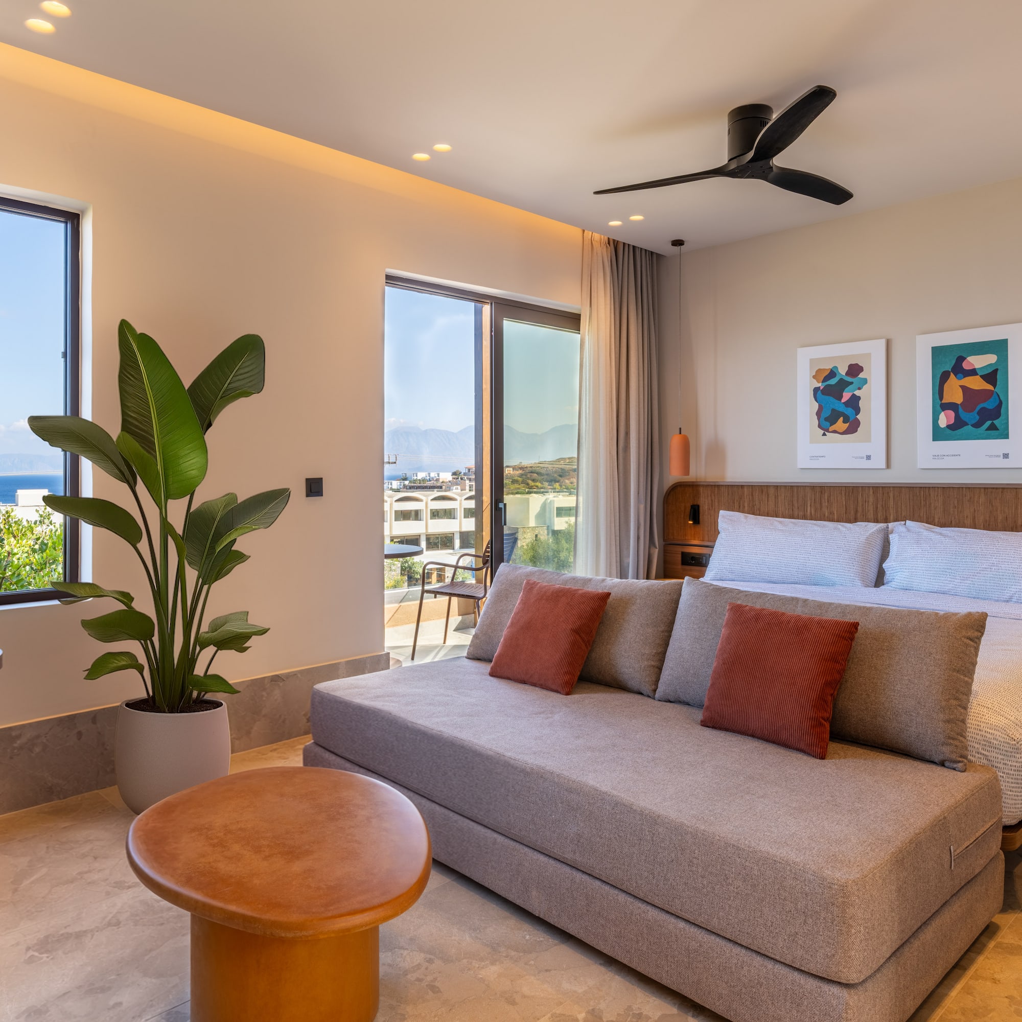 a bedroom with a bed and a plant