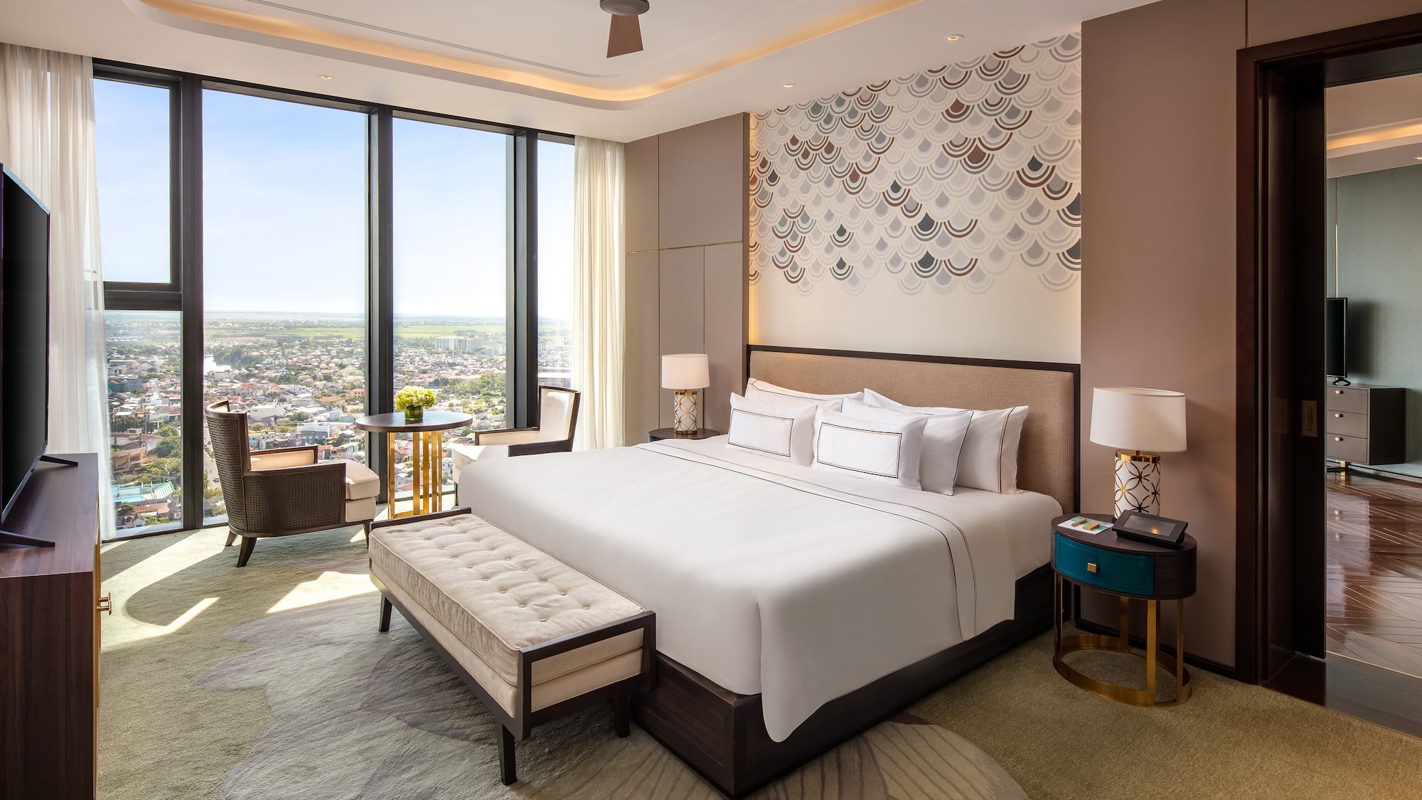 a room with a bed and a table and chairs