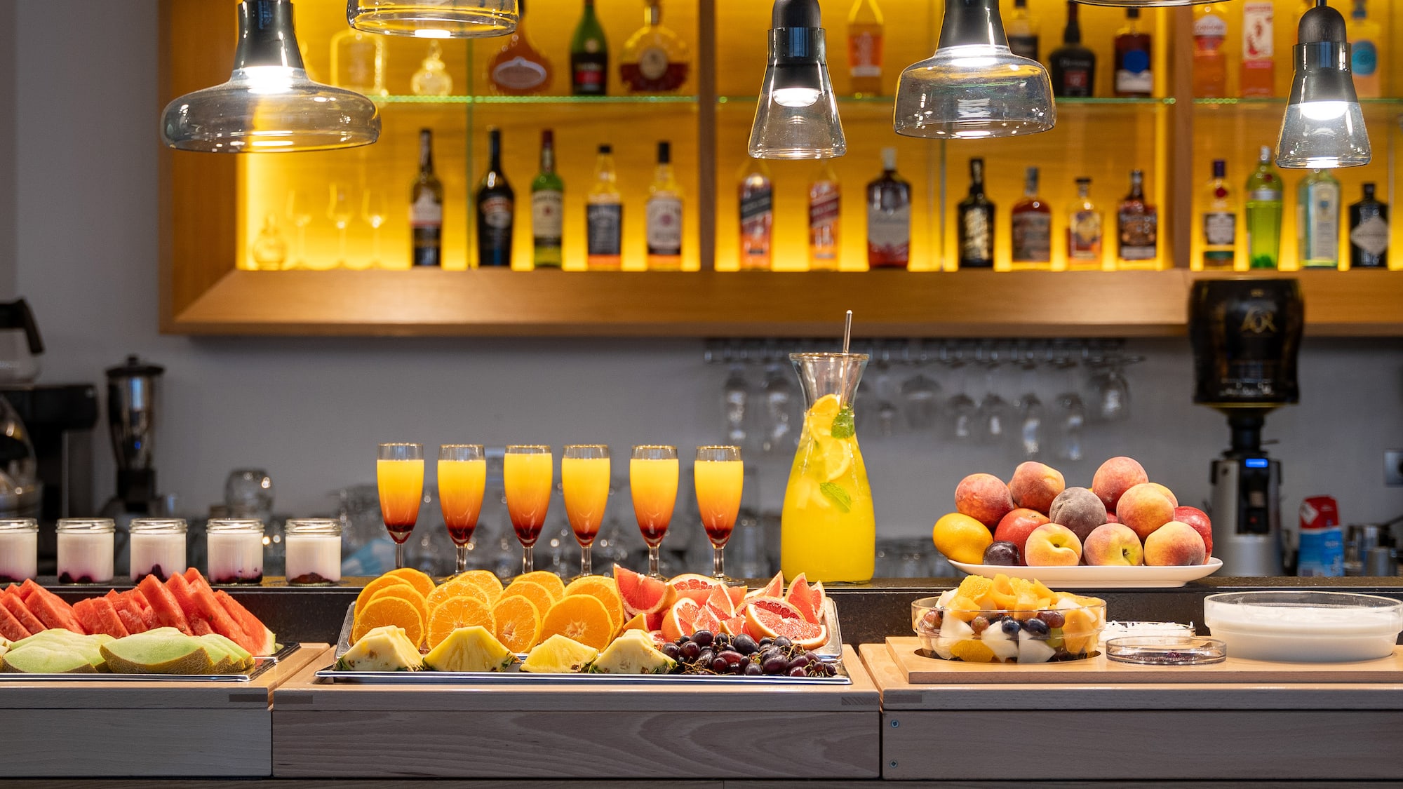 a table with fruit and drinks on it