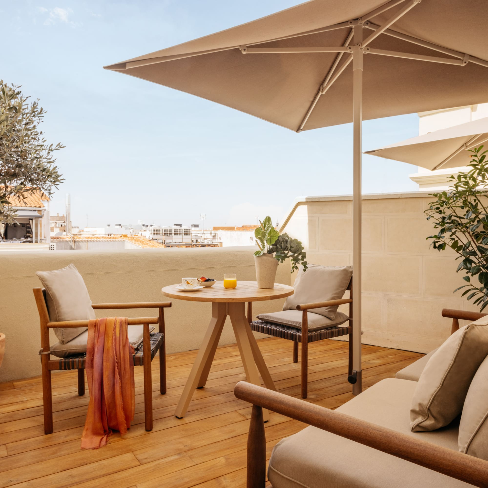 a patio with a table and chairs