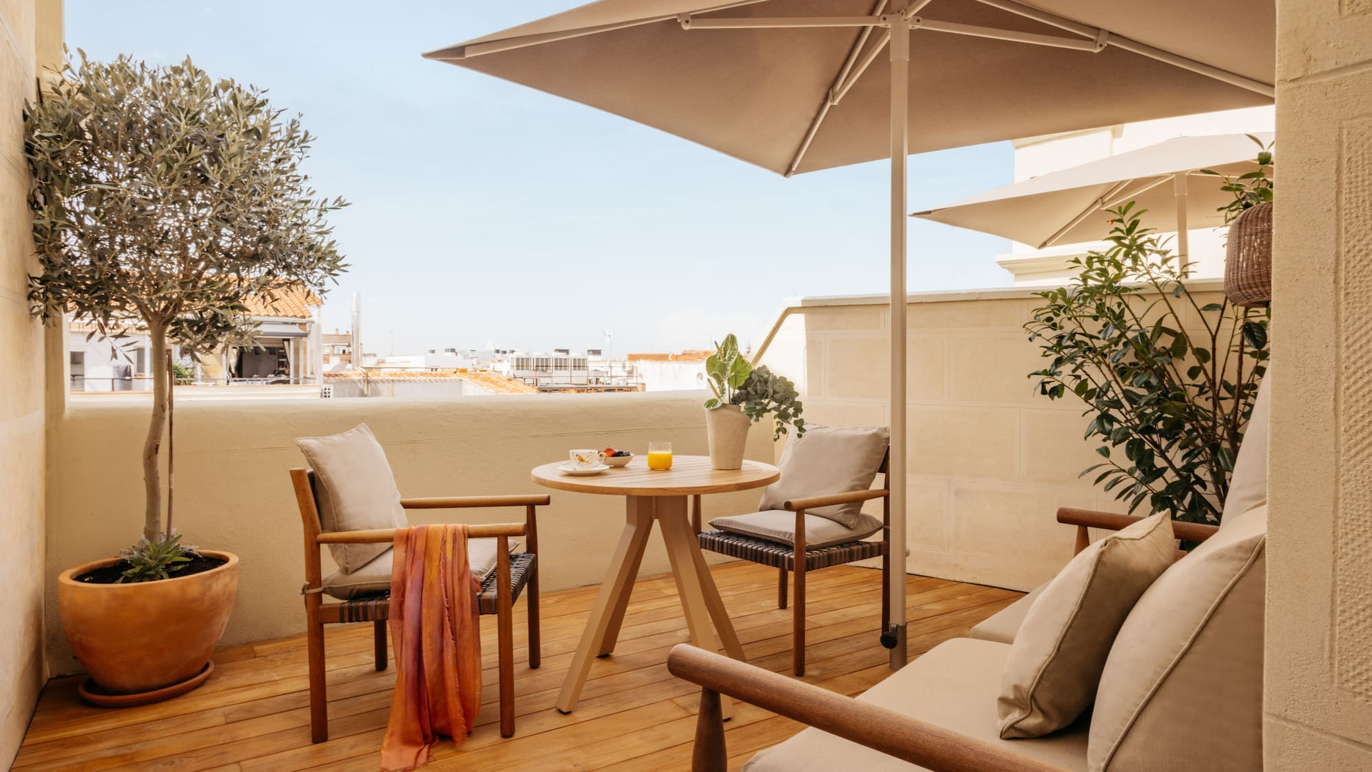a patio with a table and chairs