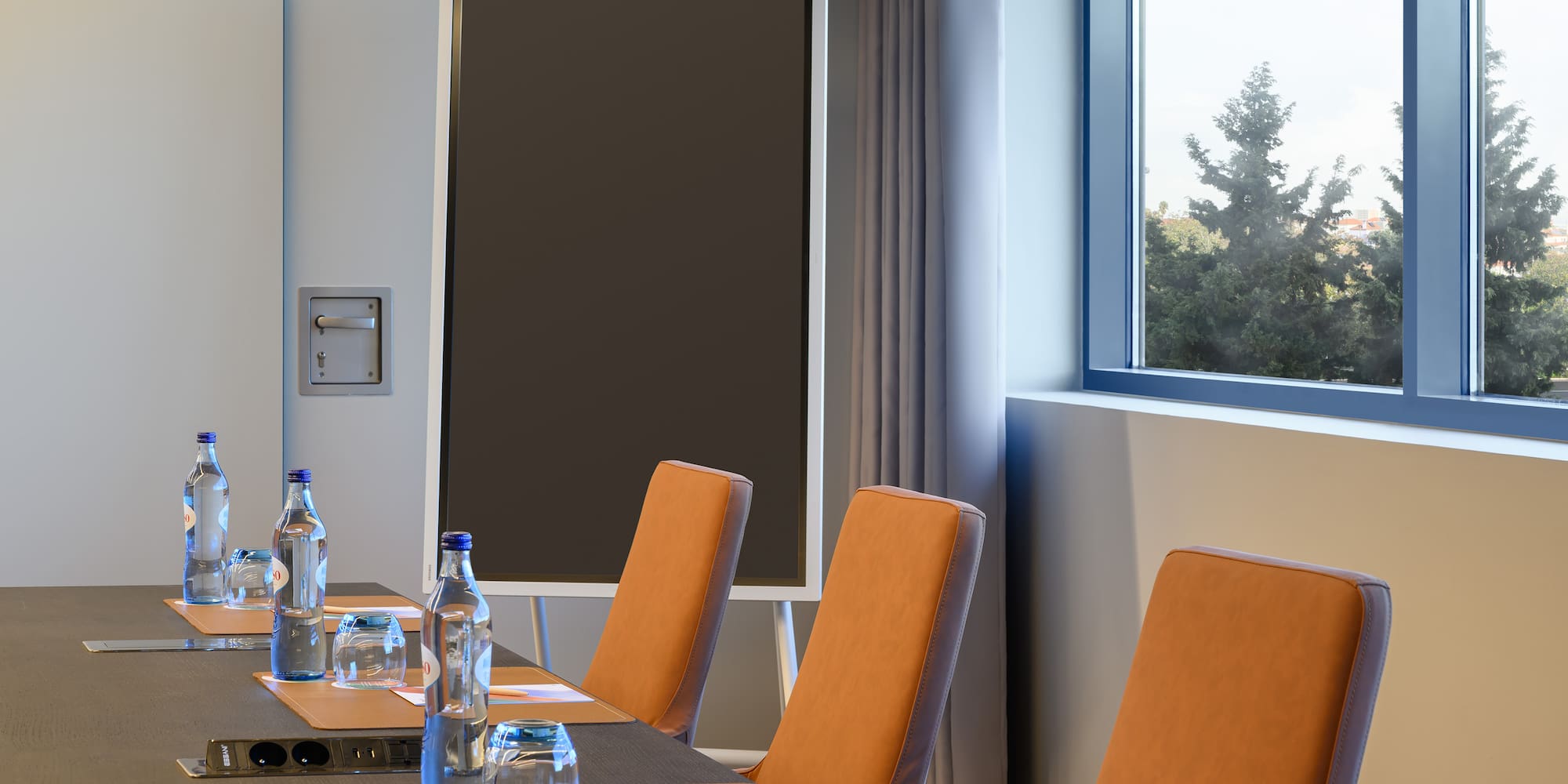 a conference room with a table and chairs