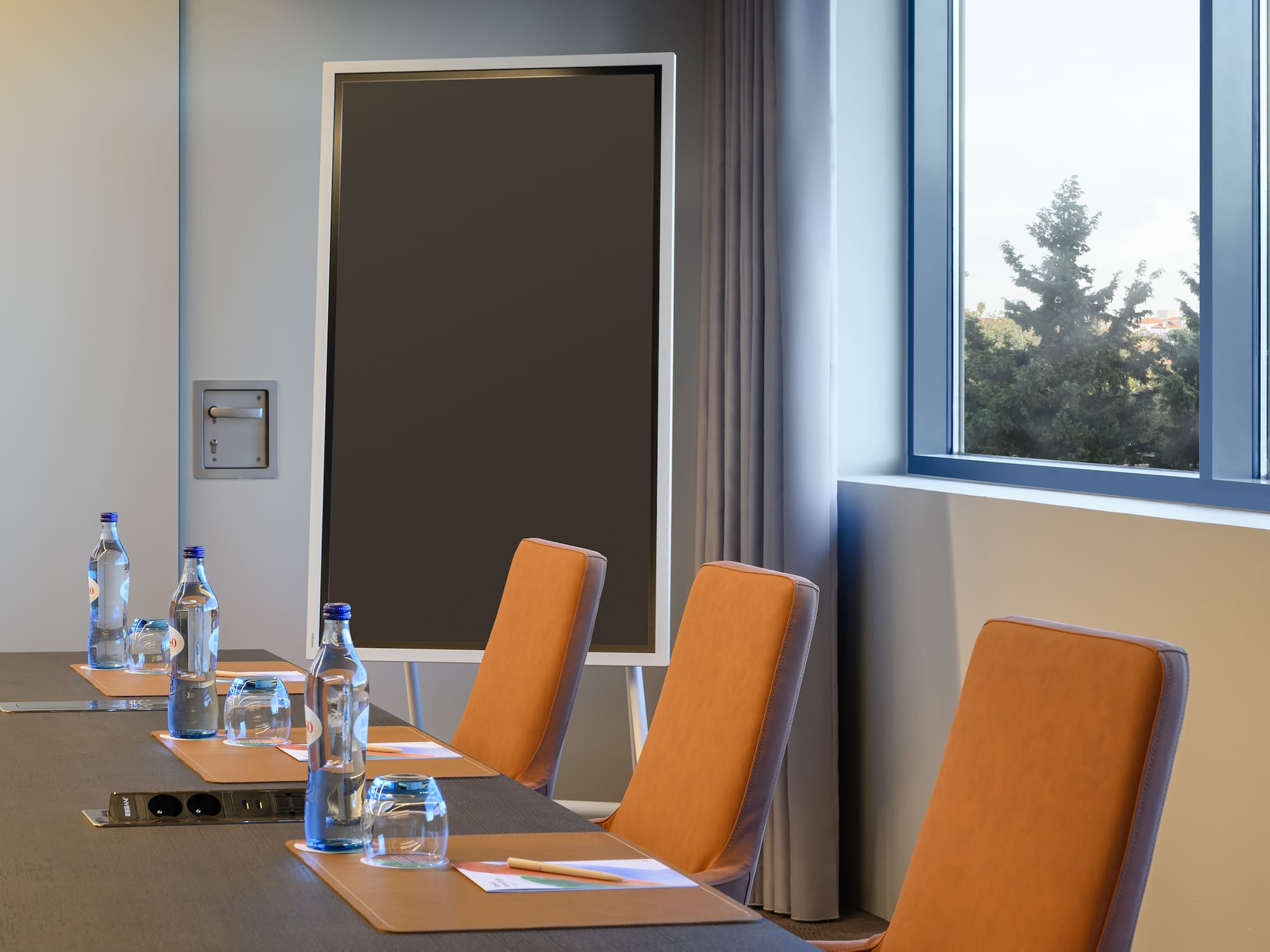 a conference room with a table and chairs