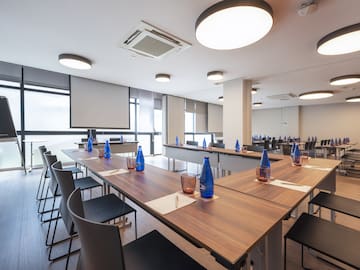 a room with tables and chairs.