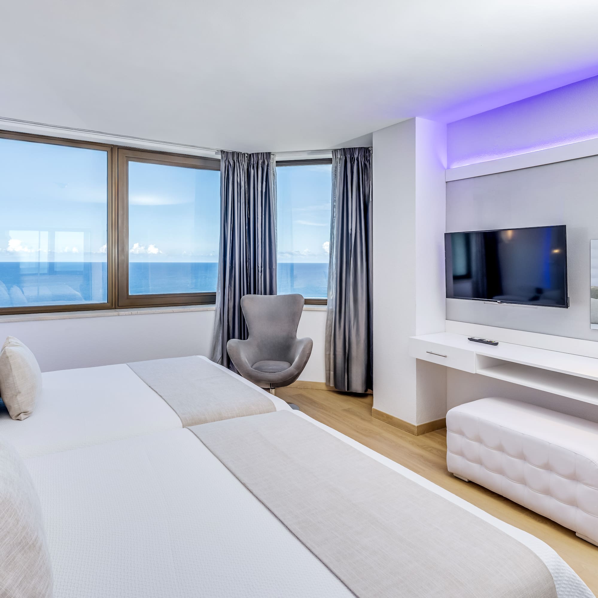 a room with a television and a bed