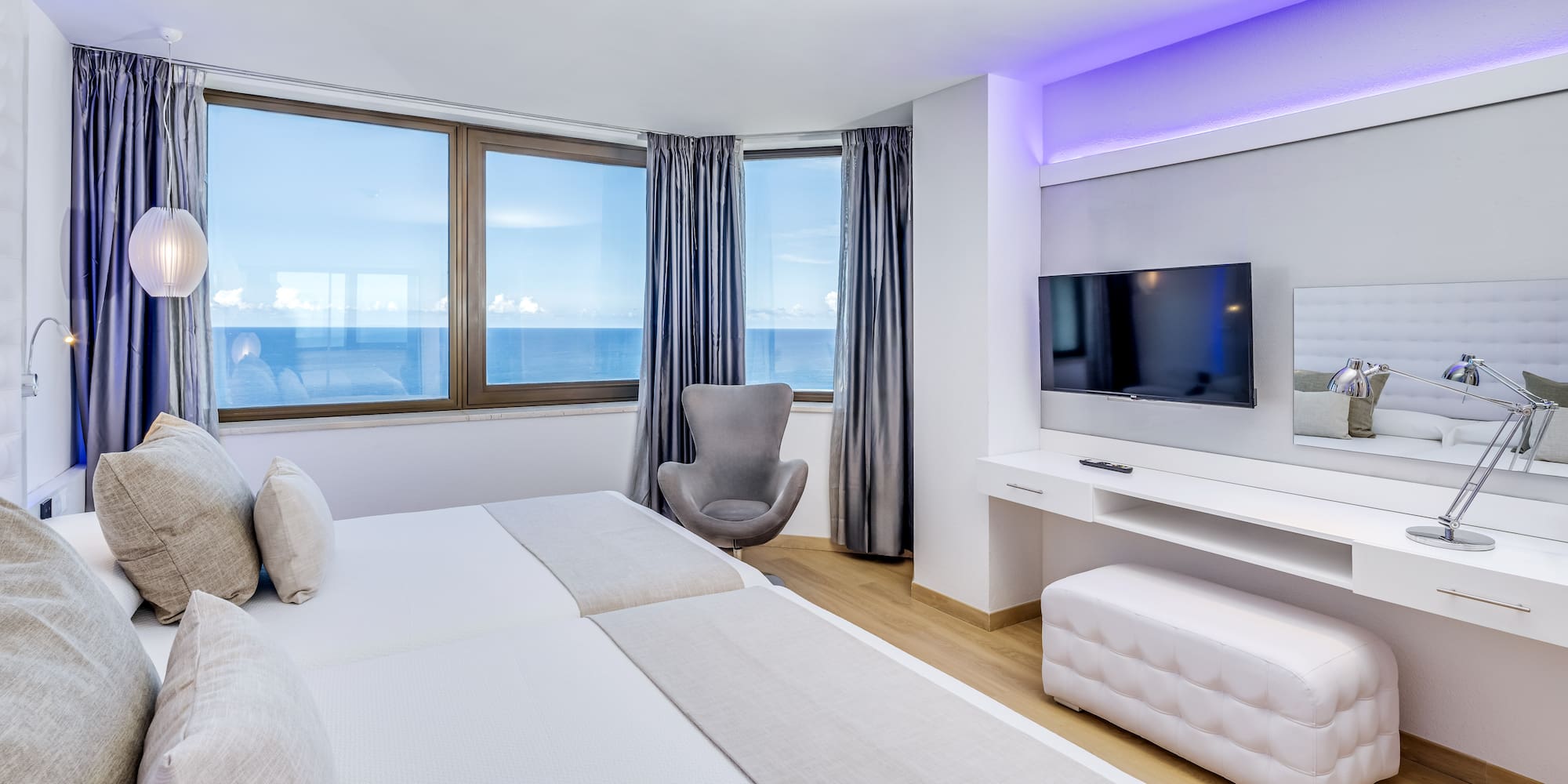 a room with a television and a bed