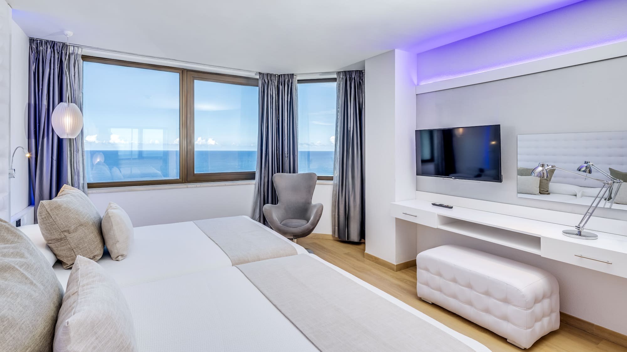 a room with a television and a bed