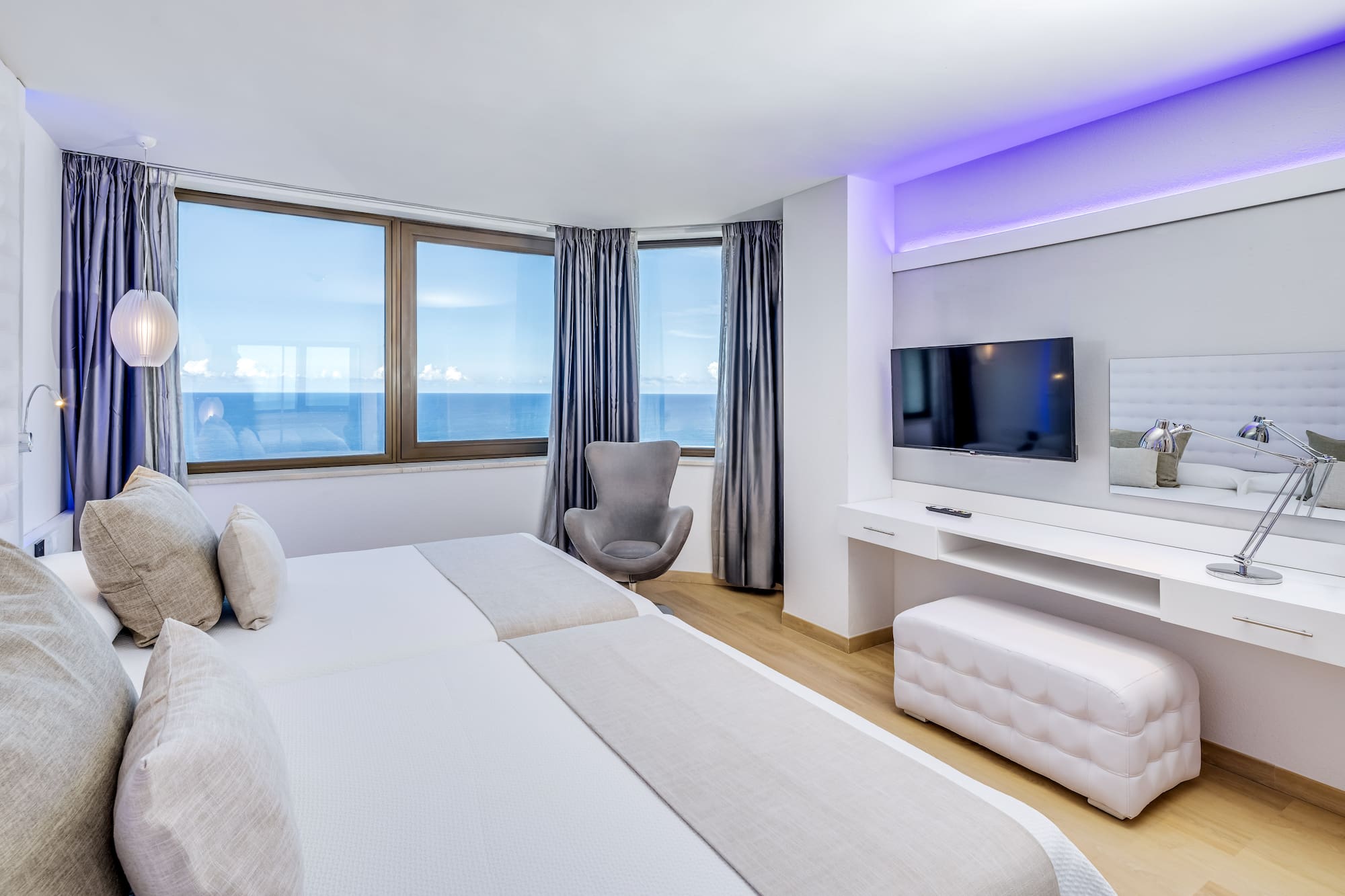 a room with a television and a bed