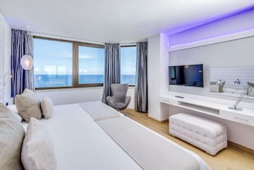 a room with a television and a bed