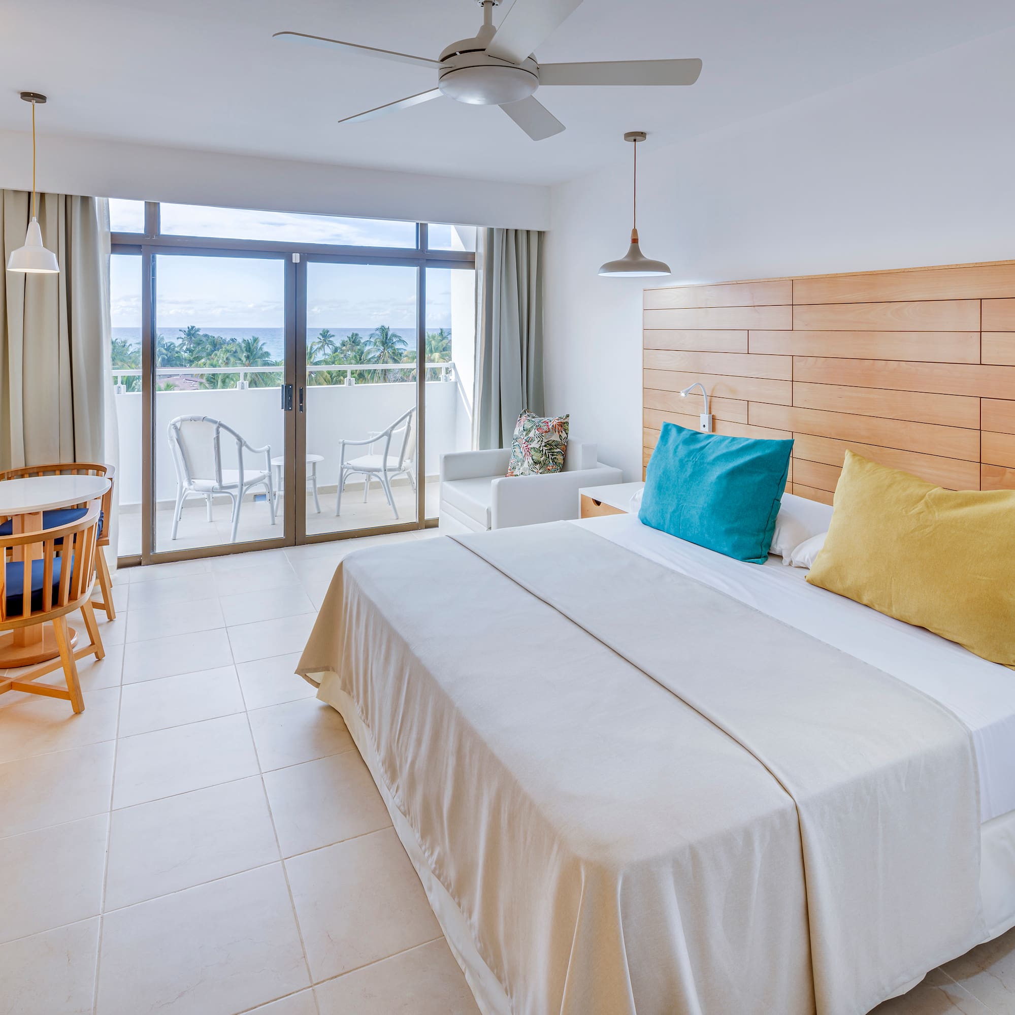 a bedroom with a bed and a ceiling fan