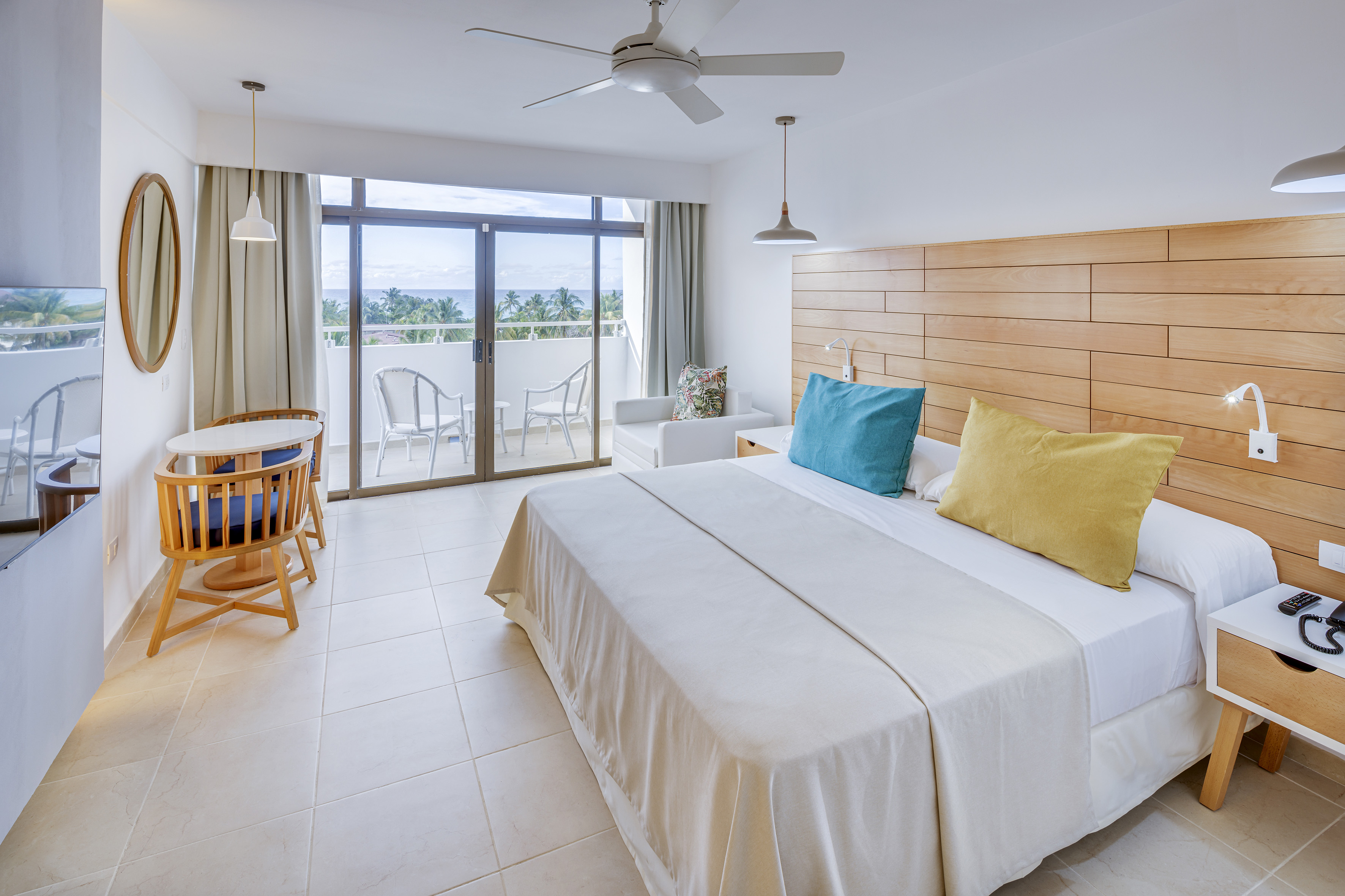 a bedroom with a bed and a ceiling fan