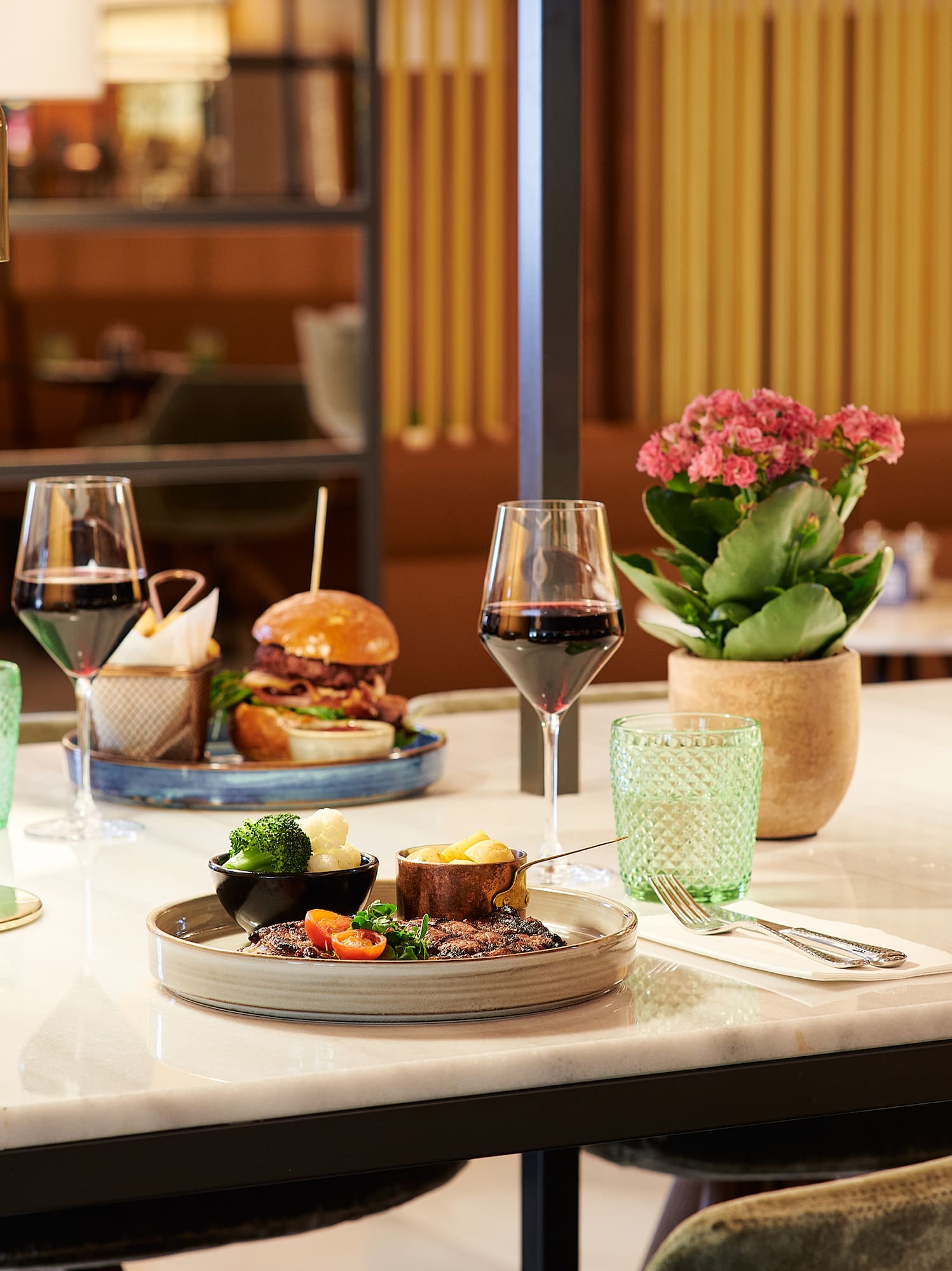 a table with food and wine glasses