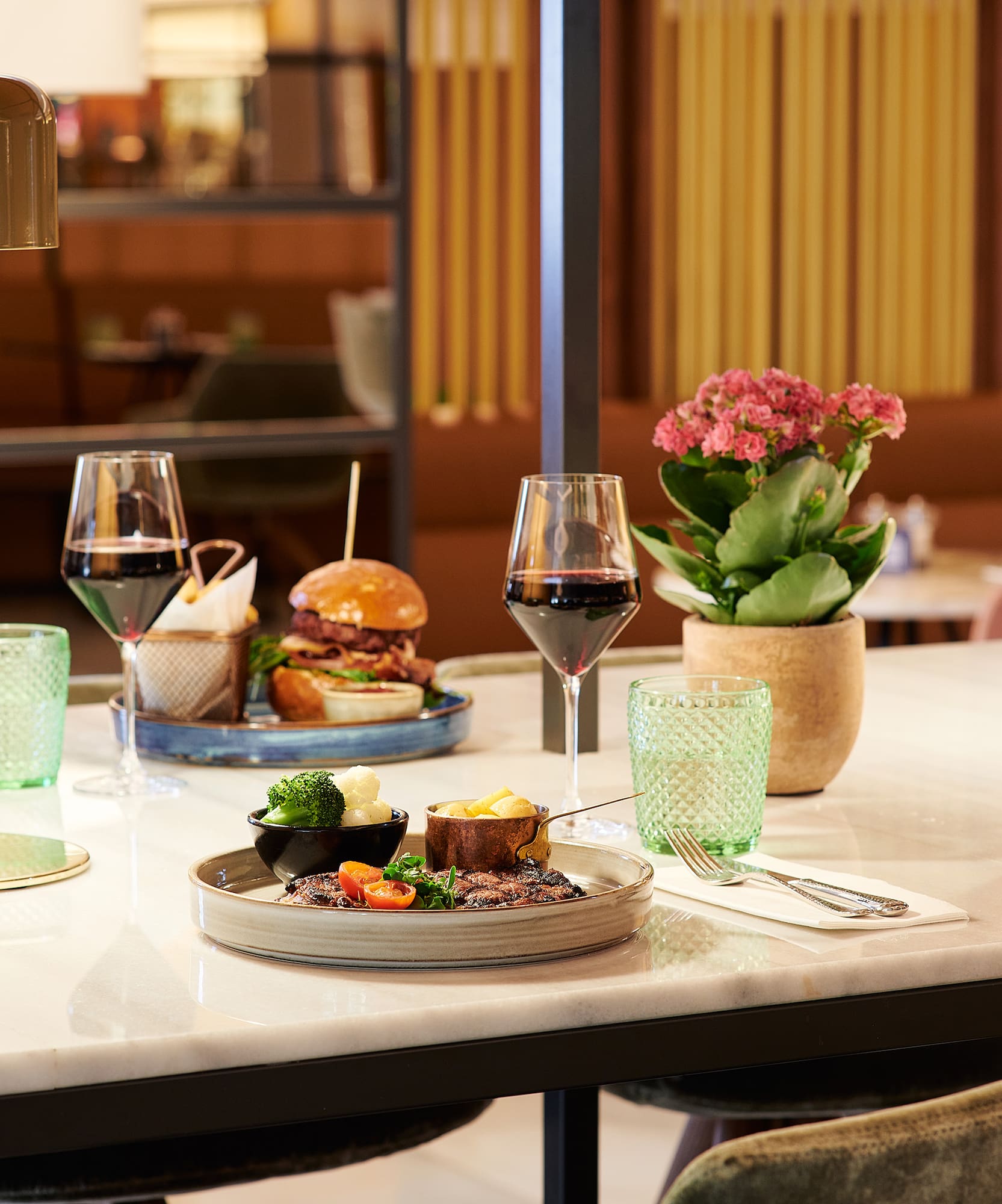a table with food and wine glasses
