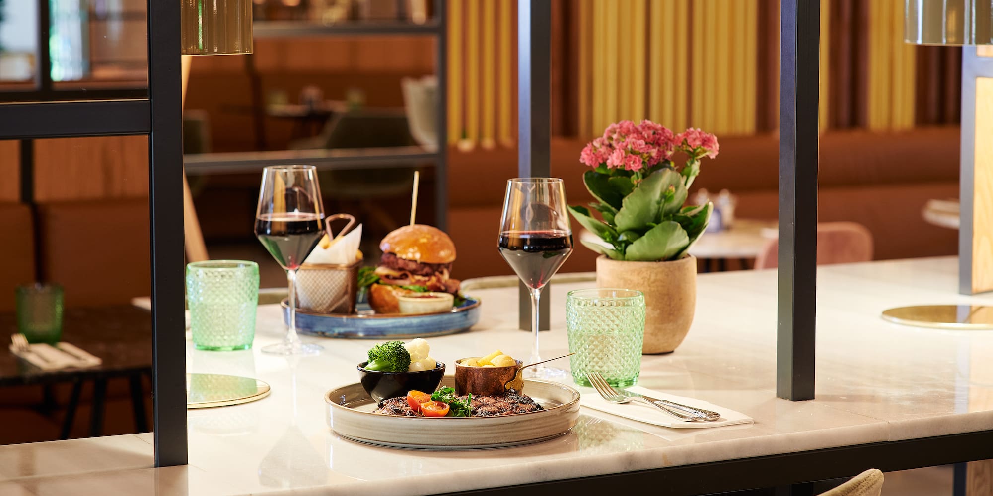 a table with food and wine glasses