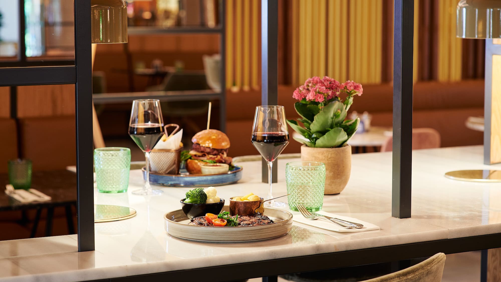 a table with food and wine glasses