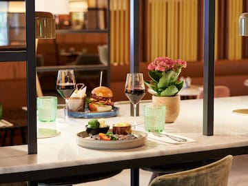 a table with food and wine glasses