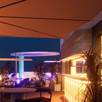 a restaurant with tables and plants